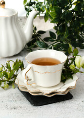 Pretty porcelain teacup with hibiscus tea