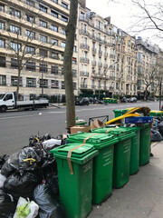 Paris, France - March 23th, 2023: Some garbage in a row in the street of Paris during the binmen strike. High quality photo