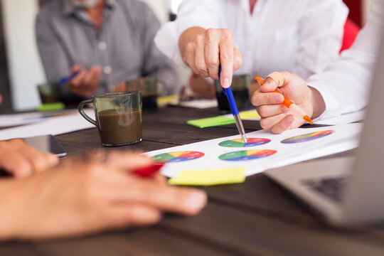 Business people analyzing charts during meeting