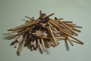 stacks of wooden matches strewn in a mountain range