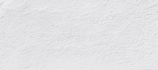 Empty concrete wall covering by white plaster.