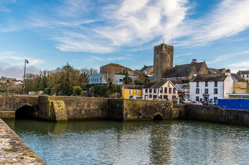 A view down the bridge over the River Cleddau towards the town of Pembroke, Wales on a bright day