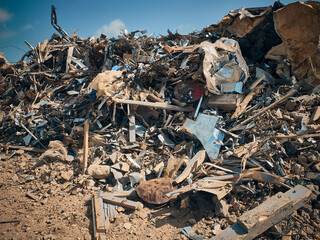 Metal reinforcement rods, lumber and other different kinds of construction debris piled....
