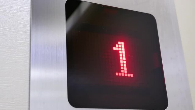 The motion of people taking the elevator from B1 to the main floor inside a shopping mall with 4k resolution.