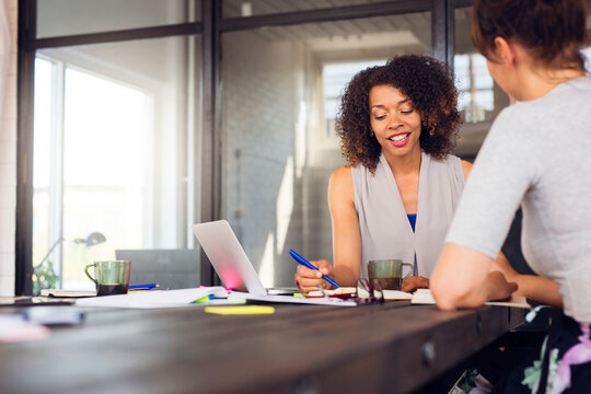 Two women working in office
