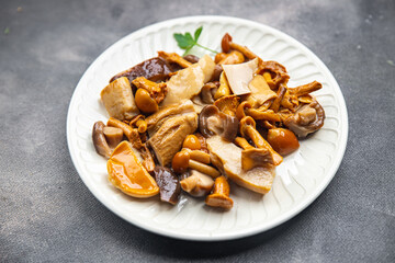 mushroom salad mix appetizer white mushroom, boletus mushroom, chanterelle mushroom, ready to eat healthy meal food snack on the table copy space food background rustic top view