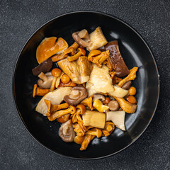 mushroom salad mix appetizer white mushroom, boletus mushroom, chanterelle mushroom, ready to eat healthy meal food snack on the table copy space food background rustic top view