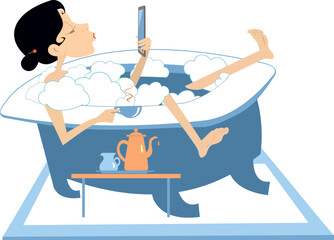 Woman taking bath, drinking coffee or tea. Chatting mobile phone.
Young woman lies in the bathtub, has coffee or tea and chats mobile phone
