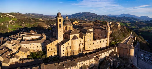 Poster One of the most beautiful medieval towns of Italy - Urbino in Marche region. aerial drone panoramic high angle view over sunset © Freesurf