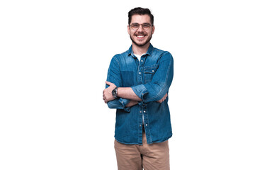 Portrait of happy fashionable handsome man in jeans shirt crossing hands and look at camera