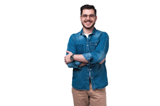 Portrait of happy fashionable handsome man in jeans shirt crossing hands and look at camera