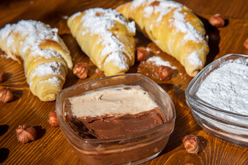 Sweet pastry with fennel cream on a wooden table...nougat cream...hazelnut cream...sweet...
