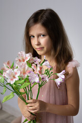 Obraz na płótnie Canvas Portrait of girl with flowers