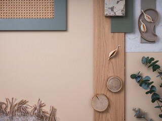 Simple flat lay composition with textile and paint samples, panels and cement tiles. Stylish interior designer moodboard. Light beige and green color palette. Copy space. Template.