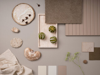 Fototapeta na wymiar Creative flat lay composition with textile and paint samples, panels and cement tiles. Stylish interior designer moodboard. Light beige and gray color palette. Copy space. Template.
