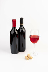 Bottle and glass with wine isolated on white