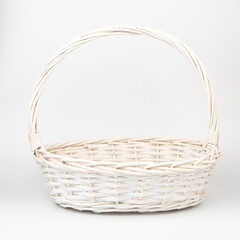 Fototapeta na wymiar White wicker basket on white background. Used for storing items and reduce the waste of plastic bags.