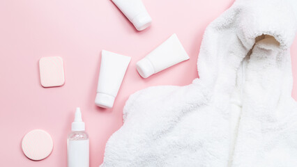 Set of skin care products on pink pastel background. Skin care concept.