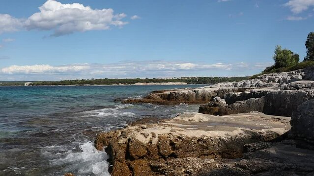 Rocky Shore in Sveti Jerolim Island in Brijuni National Park. Wave of Adriatic Sea with Stone in Croatia during Summer Day.