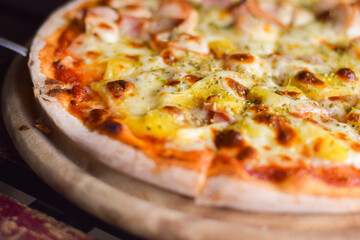 pizza hawaiian cheese on wood table. homemade food concept