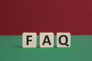 Word FAQ written with leisure game tiles. Conceptual image representing a testual message...