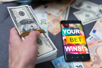betting on sports, smart phone with working online betting mobile application