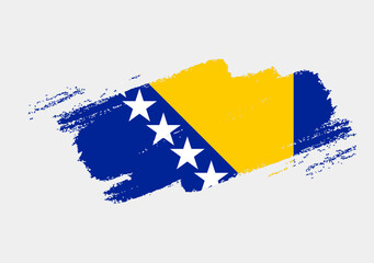 Artistic grunge brush flag of Bosnia and Herzegovina isolated on white background. Elegant texture of national country flag