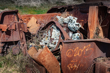 Tank Sherman M4 wreckage from WW2 in sand dunes of Normandy