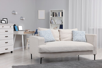 Stylish living room with comfortable sofa. Beautiful interior