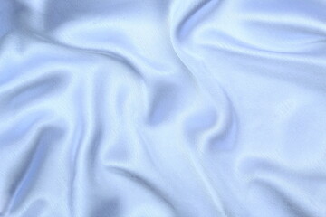 Satin beautiful fabric of gray color lies with drapery.	