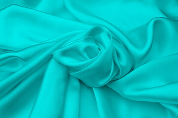 White satin smooth twisted fabric, top view.	