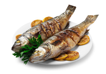 Plate with delicious sea bass fish, lemon and parsley isolated on white
