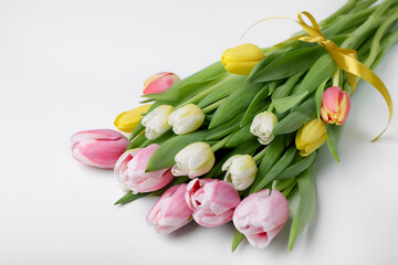Obraz premium Bouquet of beautiful tulips on light background, closeup
