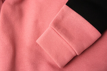 Colorful sweater with lint as background, top view. Before using of fabric shaver