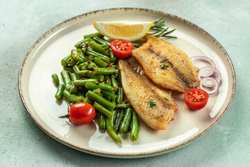 Grilled fish fillet with vegetables. Healthy food concept. place for text, top view