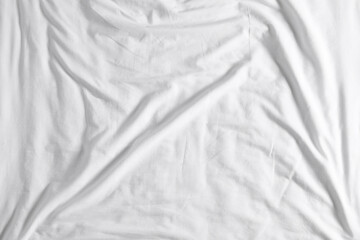 Crumpled white fabric as background, top view