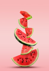 Stack of juicy watermelon slices on pink gradient background