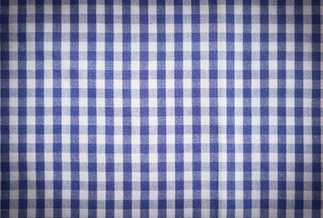 Blue and white tablecloth as background, vignette effect