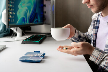 feeling stress in office, holding medicine pills and drink water, health care risk during work time