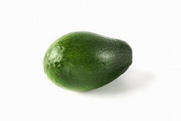 Whole, ripe, green avocado, located on a white background. Isolated