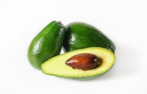 Whole and sliced avocado on a white isolated background. Clipping path