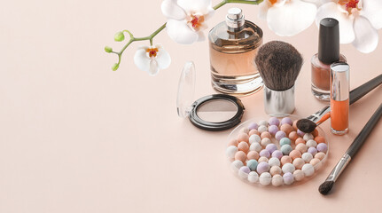 Obraz na płótnie Canvas Makeup products on pastel skin-colored background. Copy space