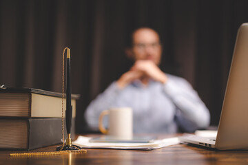 Professional businessman or worker signing job contract, person being employed at new position, male client putting signature at document in office. Recruiting, promotion, legal documentation concept