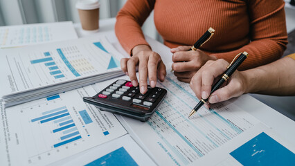 Business bookkeeping with calculator of bookkeeper and household calculating chart graph annual financial account.