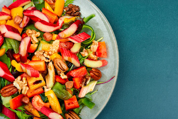 Salad with rhubarb, herbs and nuts.