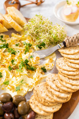 Butter board with vegetables and bread