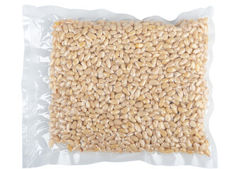 Vacuum bag with peeled pine nuts on a white background.