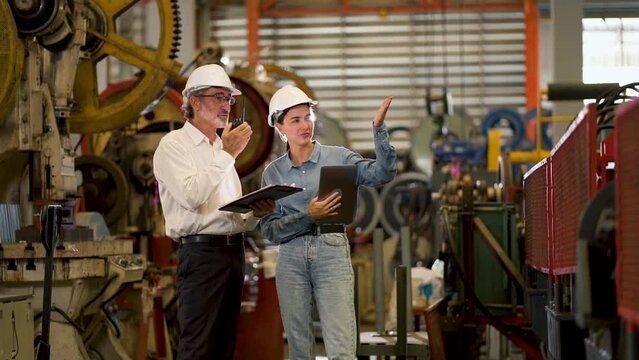 A new generation of engineers in a metal sheet factory.  Studying work methods from supervisors or colleagues and studying by yourself  be taught professionally