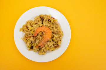 Mixed rice with seafood on small white dish