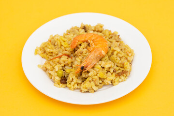 Mixed rice with seafood on small white dish